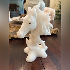 hand-carved white jade horse head statue.